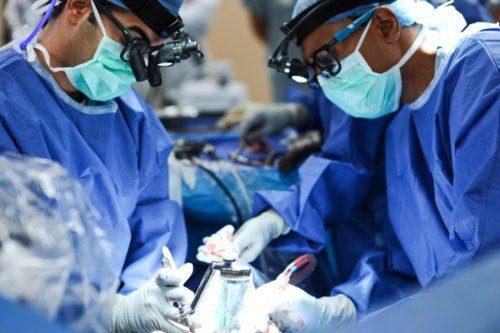 picture of Doctor Payam Moazzaz performing spine surgery in San Diego